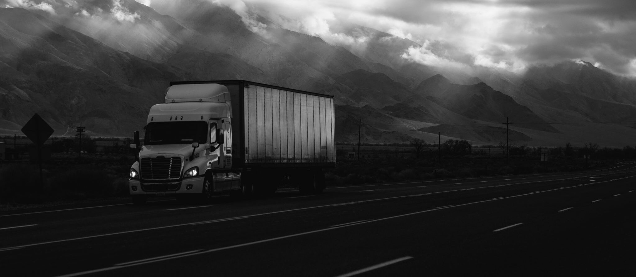 Freight containers moving through a coordinated logistics facility